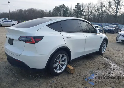2021 Tesla Model Y Standard Range Rear-Wheel Drive from USA, damaged, VIN 5YJYGDED7MF103408